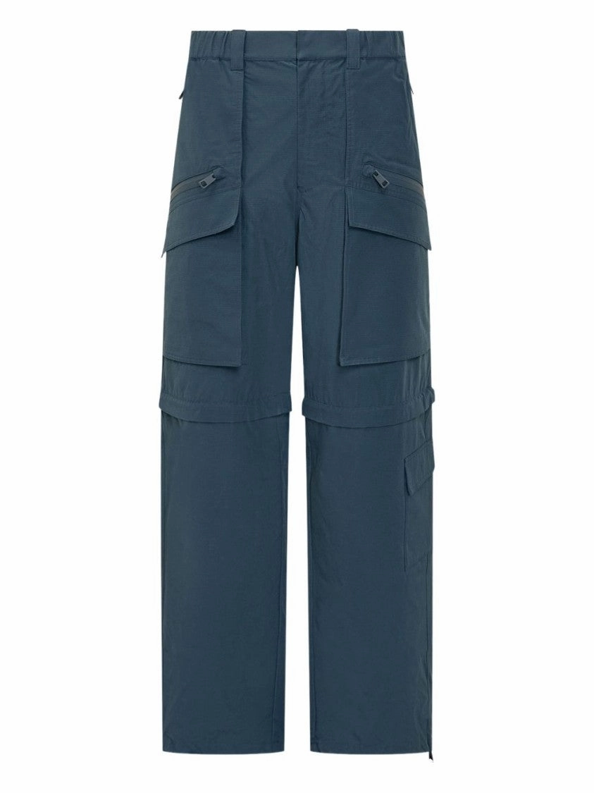 Steel Blue Trousers With Concealed Fastening And Zip Pockets